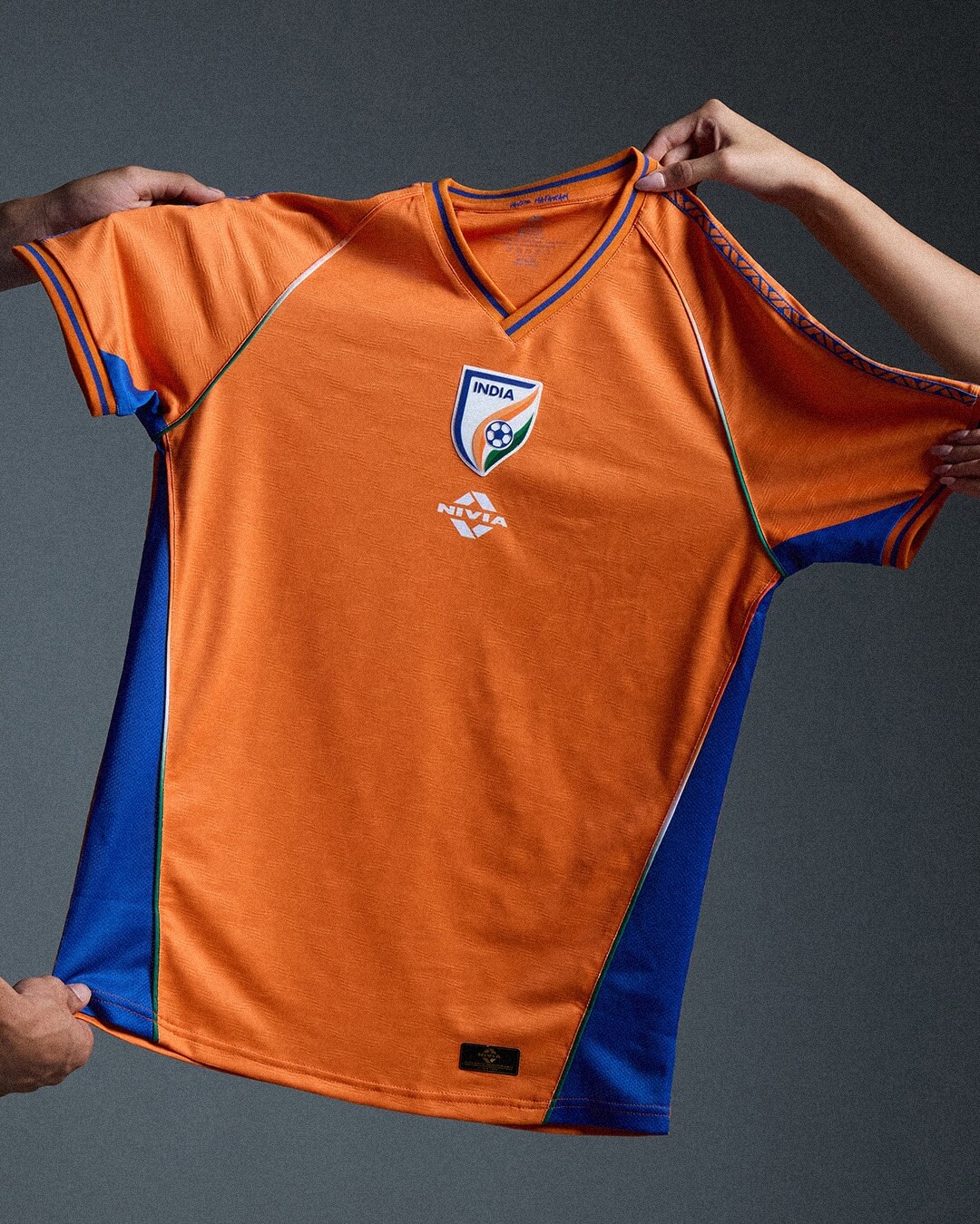 India 2026/27, orange shirt — 7