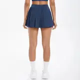 Volupie Court Pleated Skirt | Falda Plisada Deportiva con Short Interior y Bolsillo