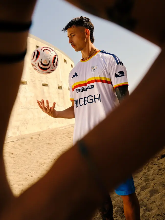 Lecce 2026/27: red and yellow across a white away shirt · presentation photographs