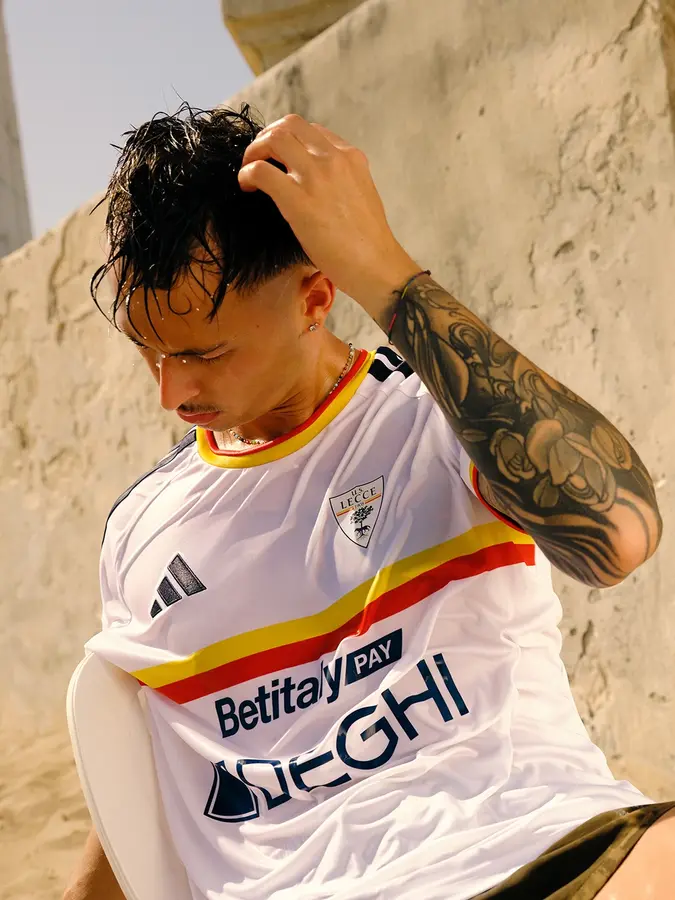 Lecce 2026/27: red and yellow across a white away shirt · 2