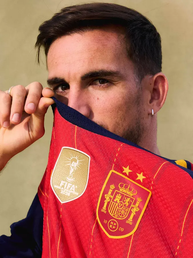 Spain: two stars and a gold patch on the red shirt · 2